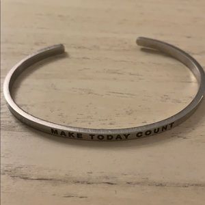 thin Mantra cuff bracelet.